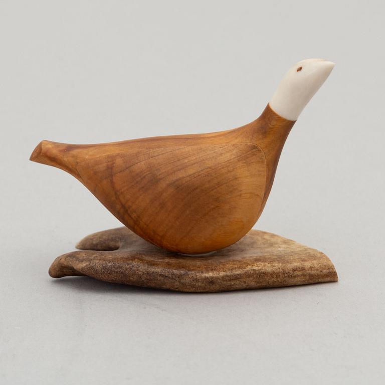 Lars Levi Sunna, a reindeer horn and birch figurine of a grouse, signed.