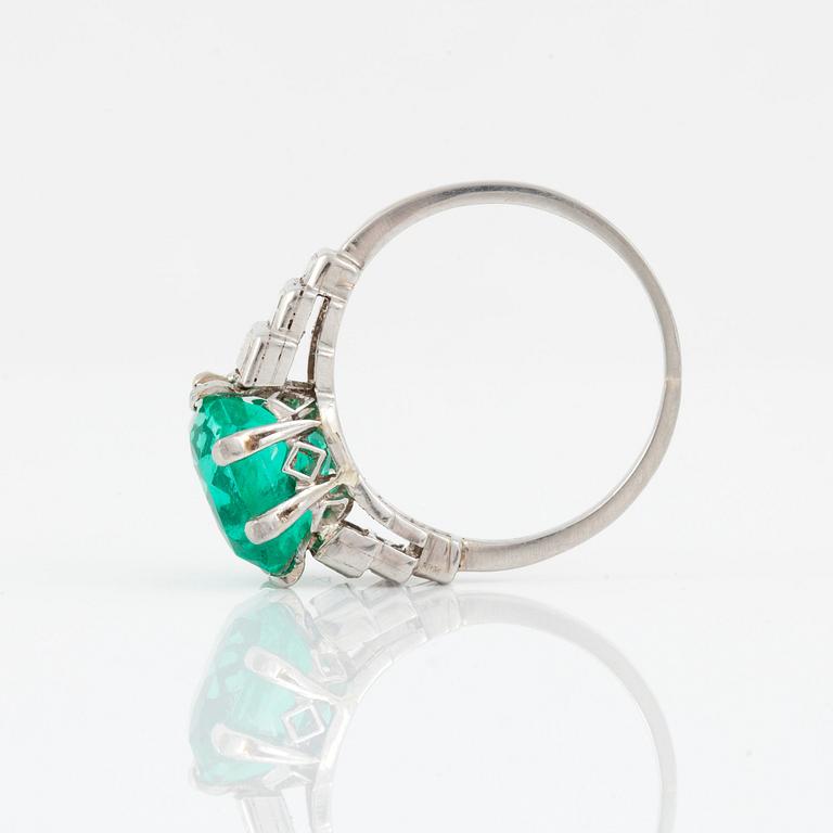 A cushion-shape mixed cut Colombian emerald, 4.56 cts, and baguette-cut diamond ring.