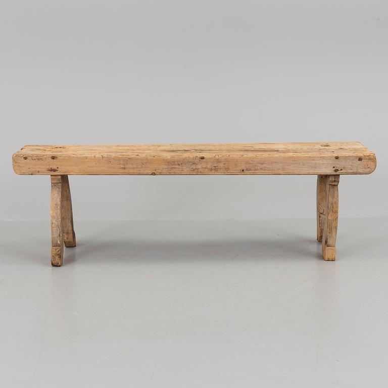 A 19th century folk art bench.