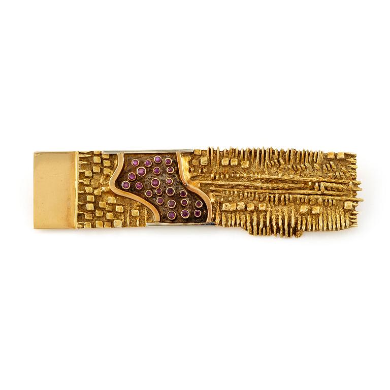 Arnaldo Pomodoro, a brooch, 18K gold with rubies, Italy 1962.