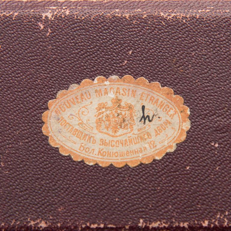 A silver case, Nikolai Kemper, and a pen and a paper knife in silver and enamel, import marks St Petersburg early 1900s.