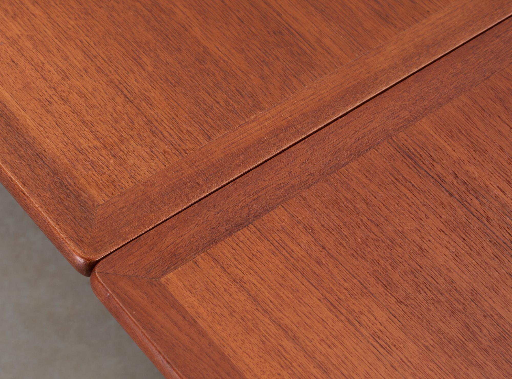 A Hans J Wegner teak and oak sabre leg dinner table by Andreas Tuck, Denmark 1950-60's.