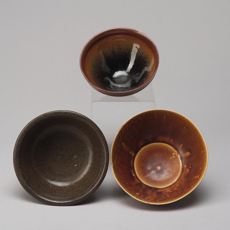 A group of three brown glazed bowls, China, 20th Century.