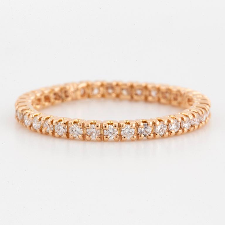 Brilliant-cut diamond eternity ring.