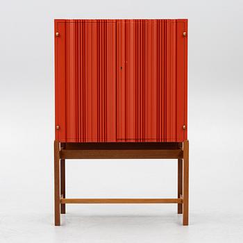 Josef Frank, a red lacquered cabinet, model 2192, 'The Cardboard Cabinet' by Svenskt Tenn, after 1985.