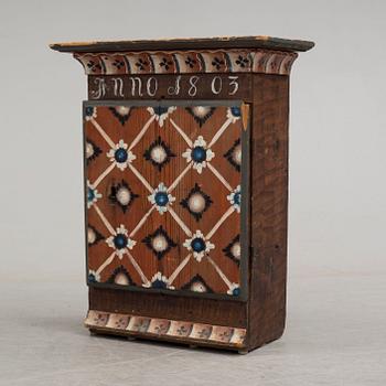 An early 19th century wall cabinet.