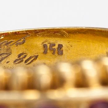 An 18K gold ring with rubies. Italy, finnish import marks.