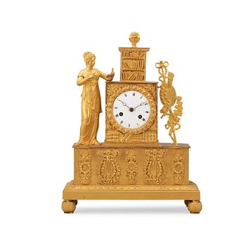 1675. A French Empire early 19th century gilt bronze mantel clock.