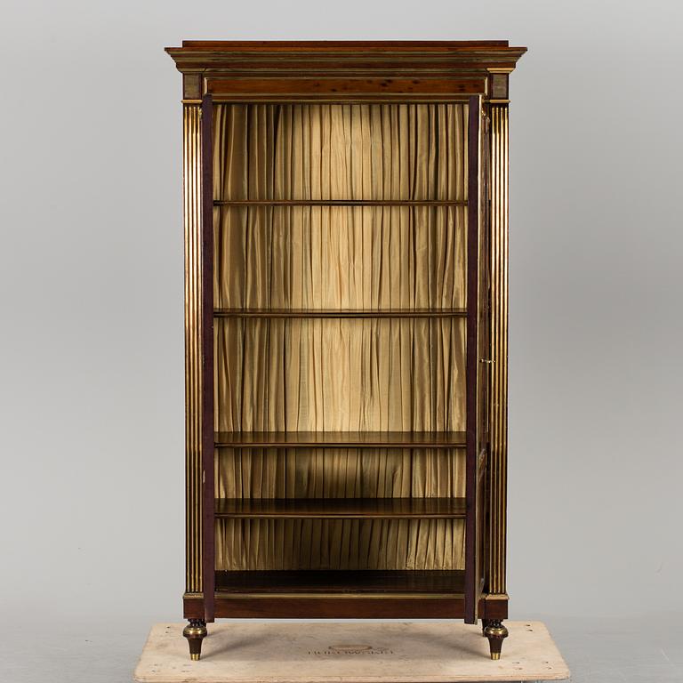 A Russian mahogany veneered display cabinet from around year 1900.