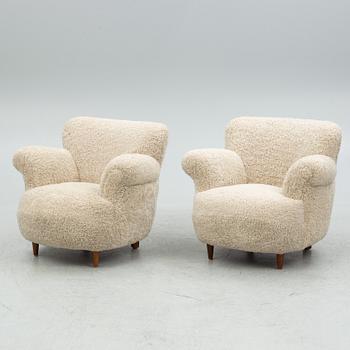 A pair of Swedish Modern easy chairs, mid 20th century.