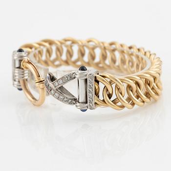 Bracelet in 18K gold with round brilliant-cut diamonds and sapphires.