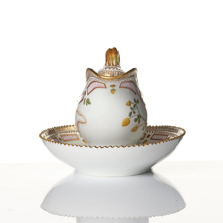 A Royal Copenhagen 'Flora Danica' sauce boat and a pillow shaped bowl, Denmark, 20th century.