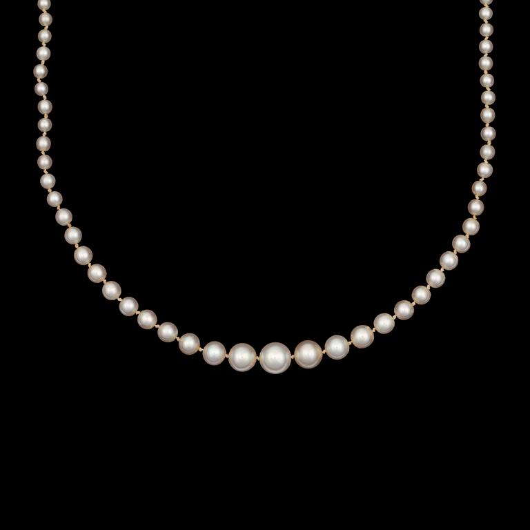 A oriental pearl, 7.4-3mm in diameter, necklace. Clasp set with marquise- and brilliant-cut diamonds app. tot. 0.70ct.