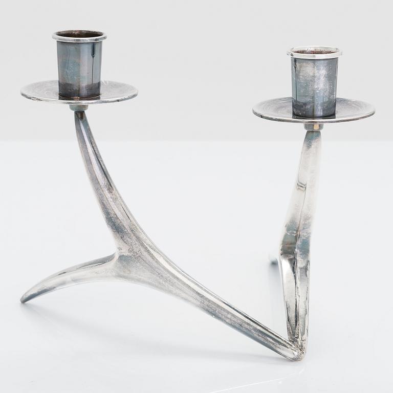 A 2-arm silver candle holder and a pair of silver candlesticks, Anna-Greta Eker and Hopearae Lasander, Turku 1965, 1963.