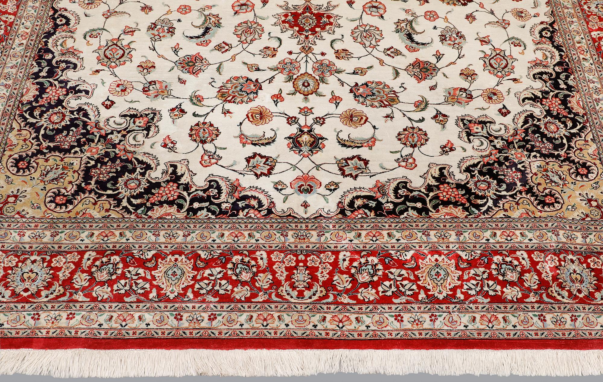A silk Ghom carpet, 295 x 195 cm.