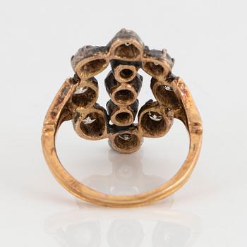 An 18K gold and silver ring set with old-cut diamonds.