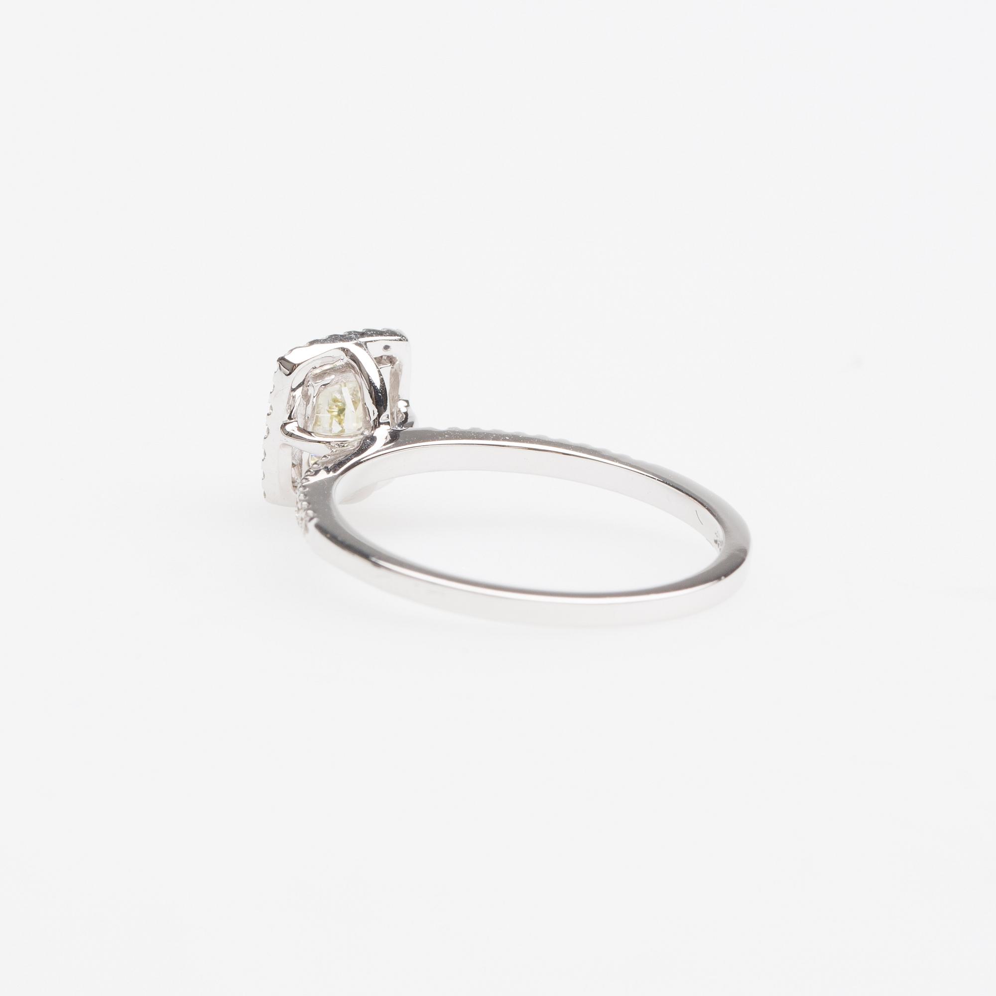RING, 14K vitguld med fasettslipad gul diamant ca 0.70 ct.