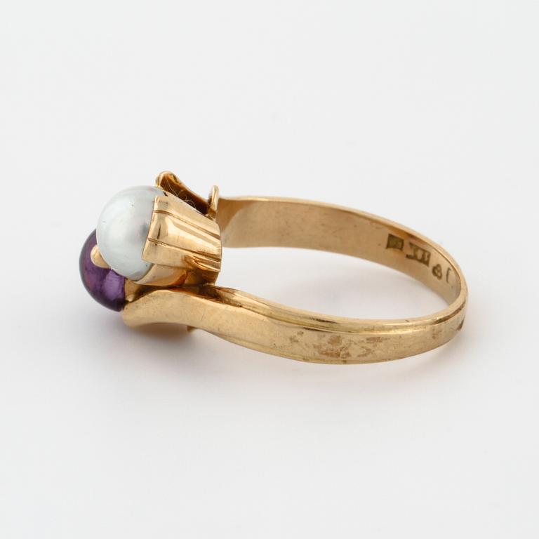 A cultured pearl and cabochon cut amethyst ring by  Stigert, Stockholm, 1955.