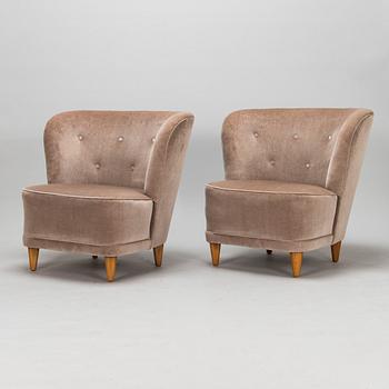 A mid-20th-century pair of armchairs.