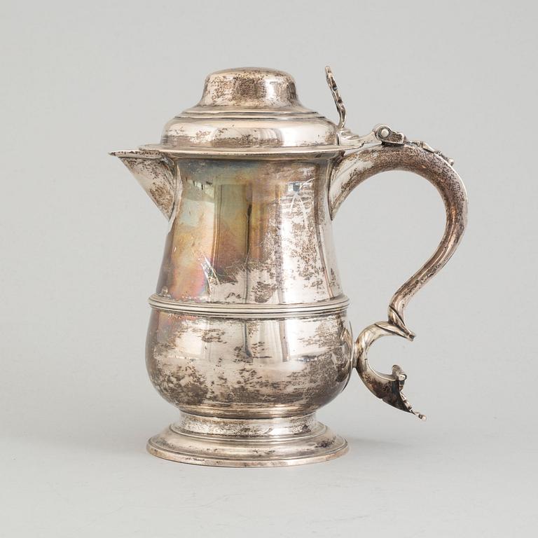 A Silver jug, possibly John Munns dated 1772.