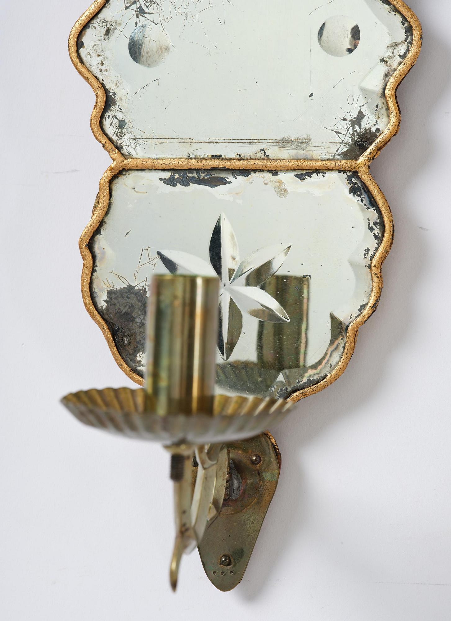 A pair of Swedish late Baroque one-branch girandole mirrors, mid 18th century.
