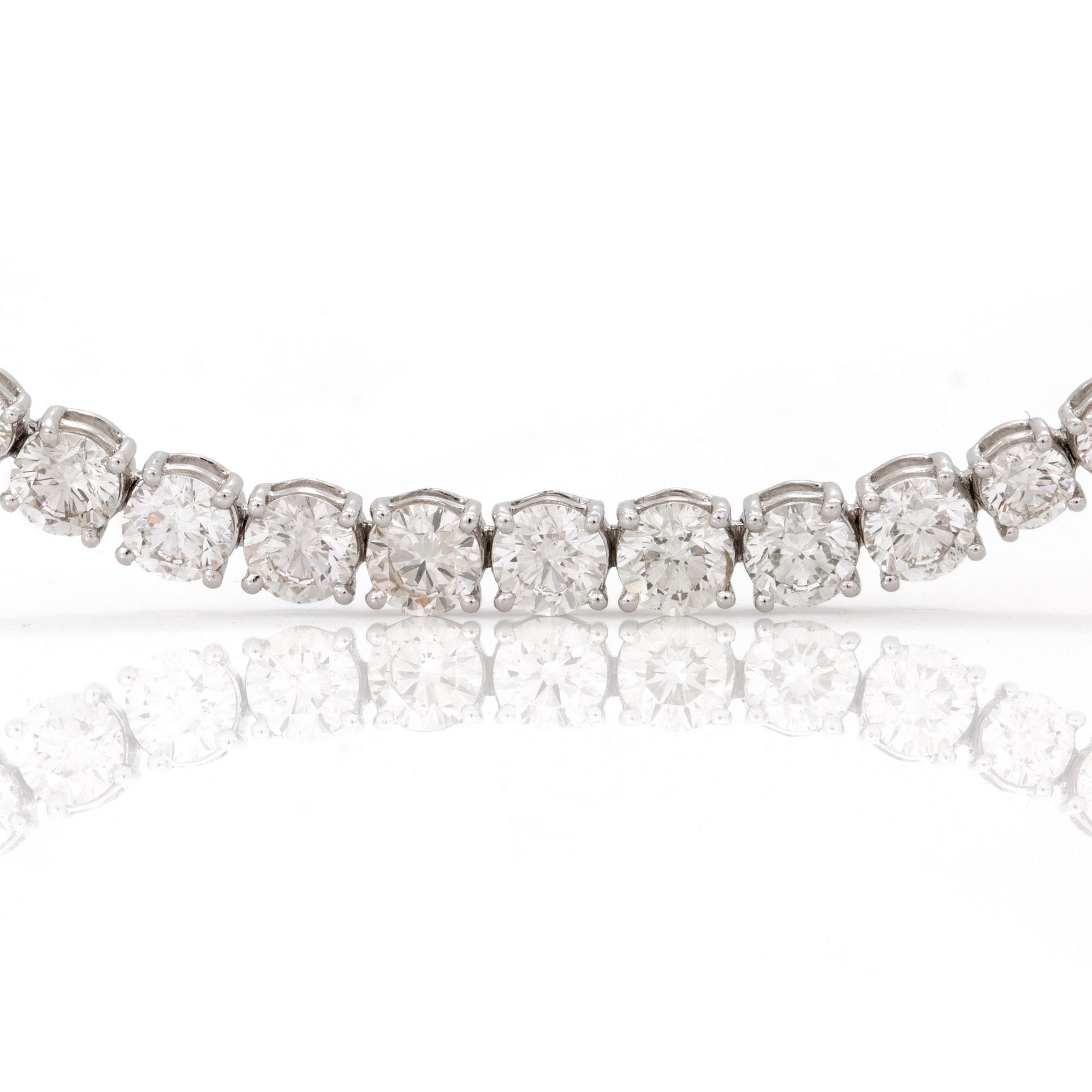 A line necklace with 104 brilliant cut diamonds total carat weight circa 25.44 cts. Quality circa G-H/VS-SI.