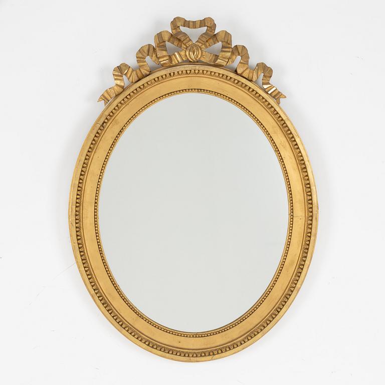 A gustavian style mirror, beginning of the 20th century.