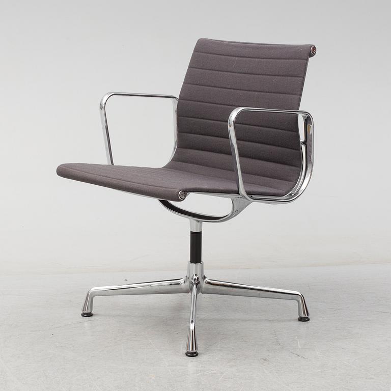 An 'EA 104 Swivel' armchair by Charles & Ray Eames, Vitra, 2007.