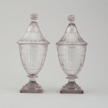 A pair of glass lidded vases, 18th/19th century.