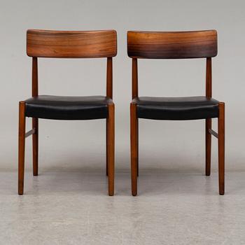 A 1950's/60's rosewood dinner table with four chairs, Denmark.