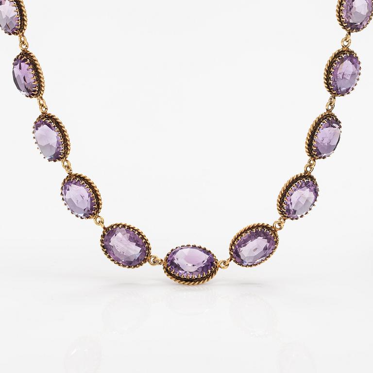 A necklace, bracelet and two brooches in gilded silver and with amethysts and pearls.