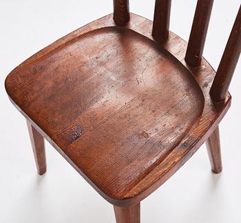 Axel Einar Hjorth, a set of four stained pine 'Utö' chairs, Nordiska Kompaniet Sweden 1930's.