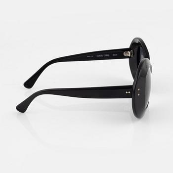 Oliver Goldsmith, a pair of black "Uuksu" sunglasses.