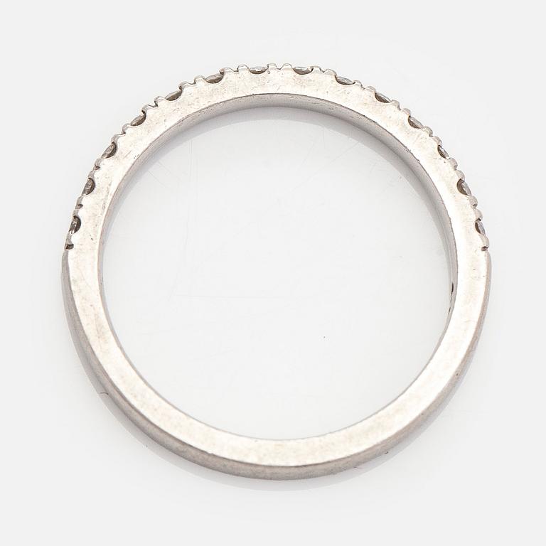 A platinum ring with brilliant cut diamonds.