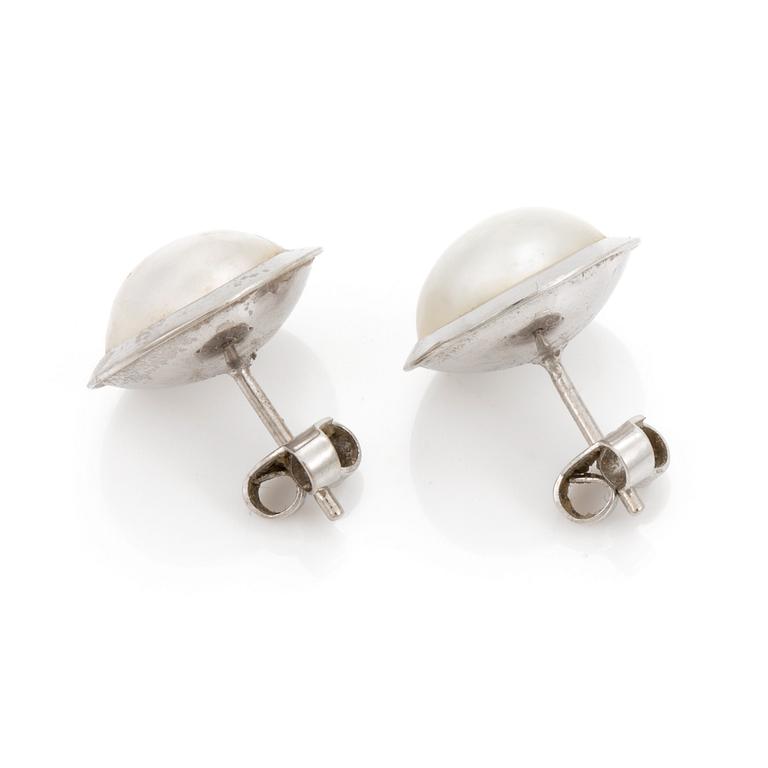 A pair of cultured mabé pearl earrings.