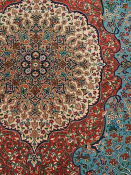 A carpet, an old Tabriz, ca 263,5-266 x 165,5-169,5 cm (as well as 1-1,5 cm blue and terracotta striped flat wear).