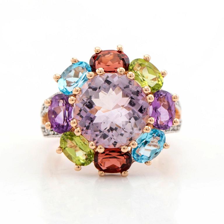 Cocktail ring, 14K gold with various gemstones, including garnet and peridot as well as brilliant-cut diamonds.