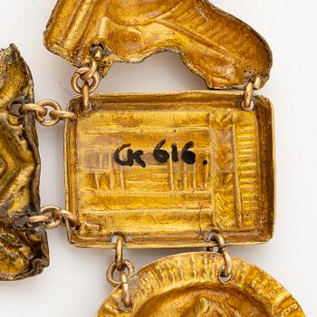 A modern Egyptian-style gold and pearl necklace.