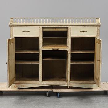 An early 19th Century painted late Gustavian cupboard.