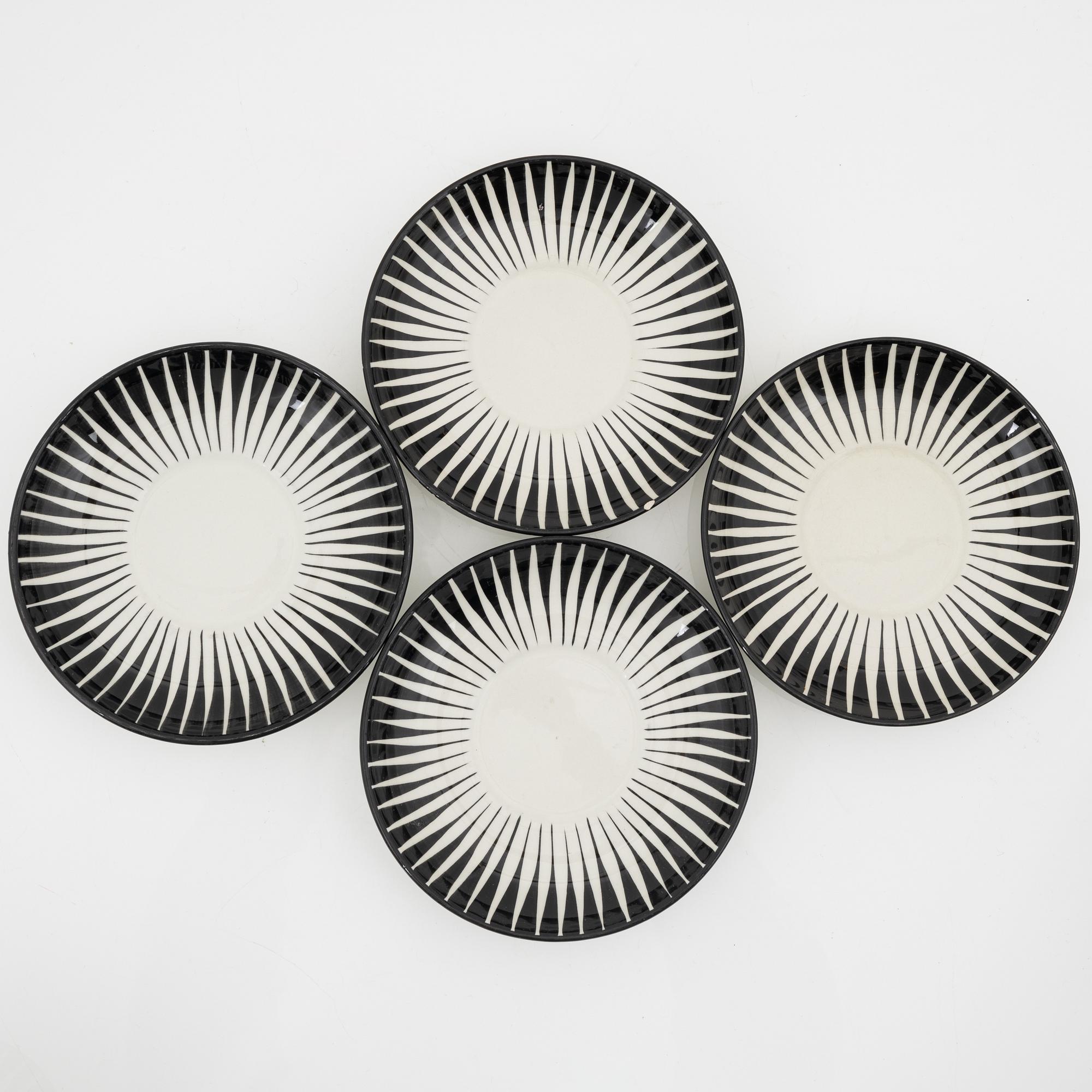A set of four teacups with saucers  by Eugen Trost for Gefle.