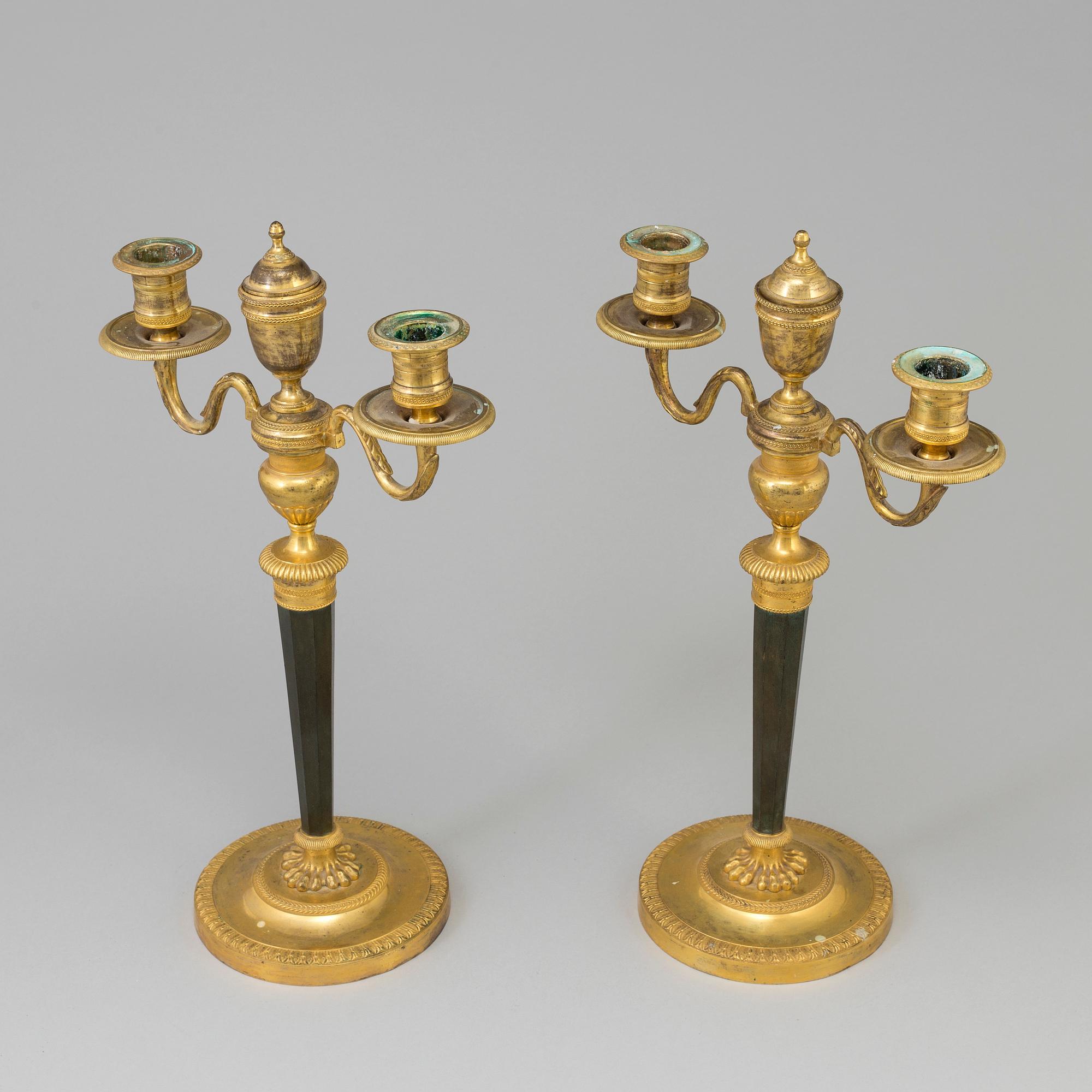 A pair of French Directoire late 18th century ormolu candelabra for three candles.