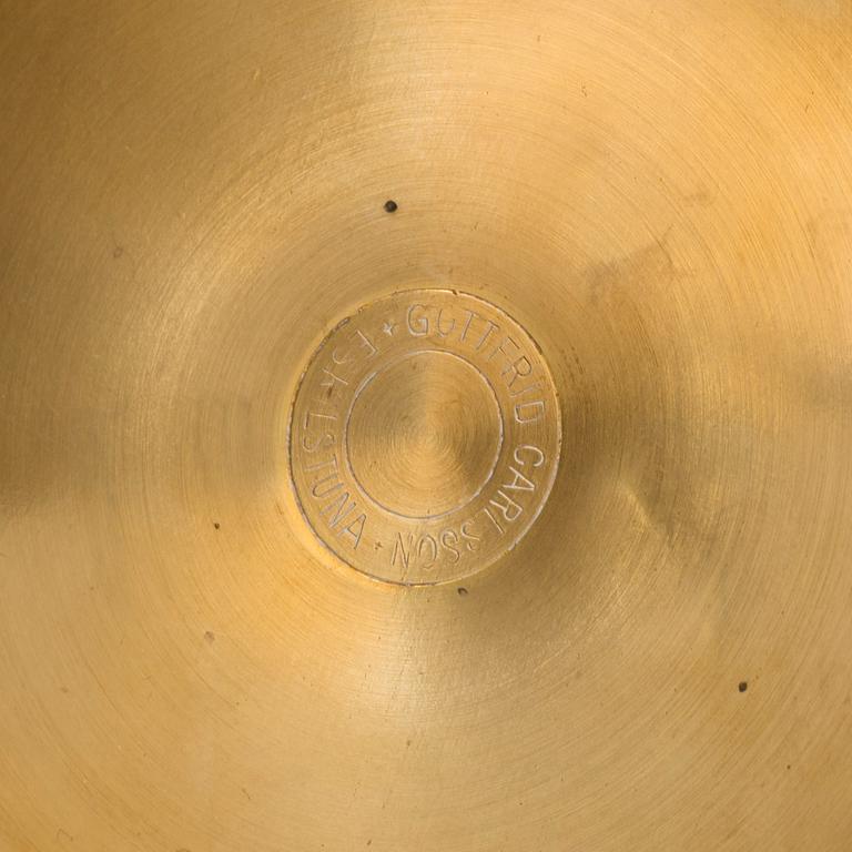 a pair of brass candelabras by Gottfrid Carlsson Eskilstuna.