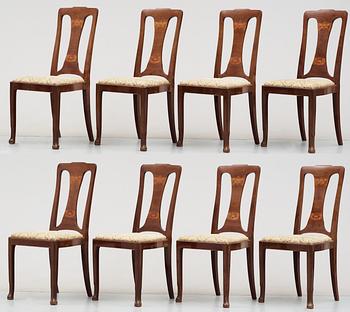 A Swedish Art Noveau mahogany dinner table with eight chairs, Kullman & Larsson, Malmö 1914.