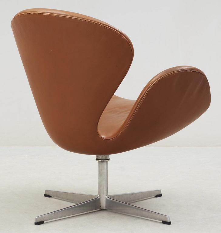 An Arne Jacobsen brown leather 'Swan' chair, Fritz Hansen, Denmark 1960's.
