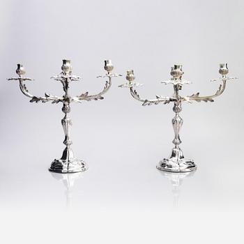A pair of German 18th century silver candelabras, mark of C.C. Papcke, Stralsund.