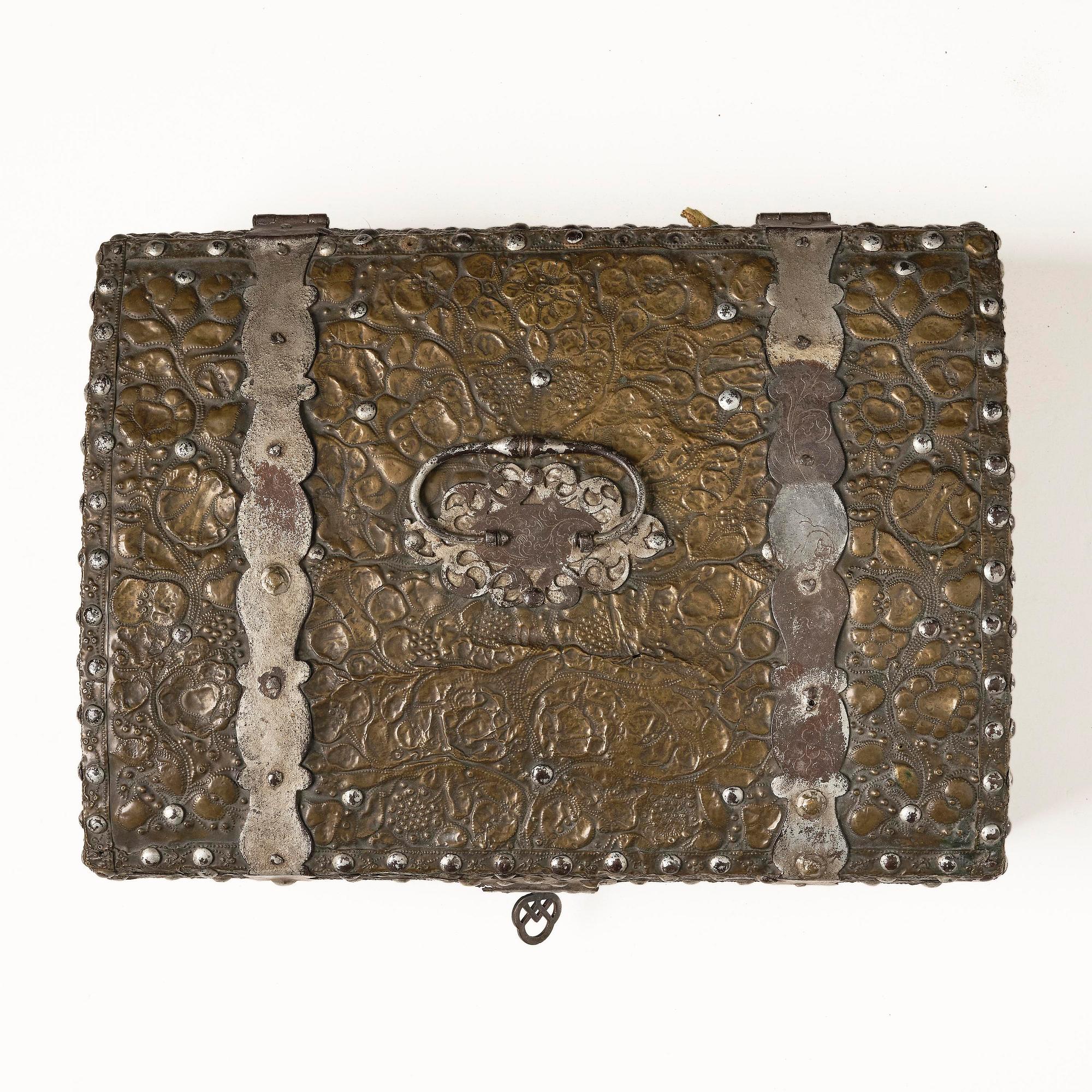 A presumably German baroque repoussé brass writing box, late 17th century.