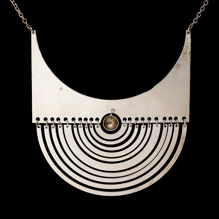 TAPIO WIRKKALA, A PENDANT, "Crescent", silver. Westerback 1972.