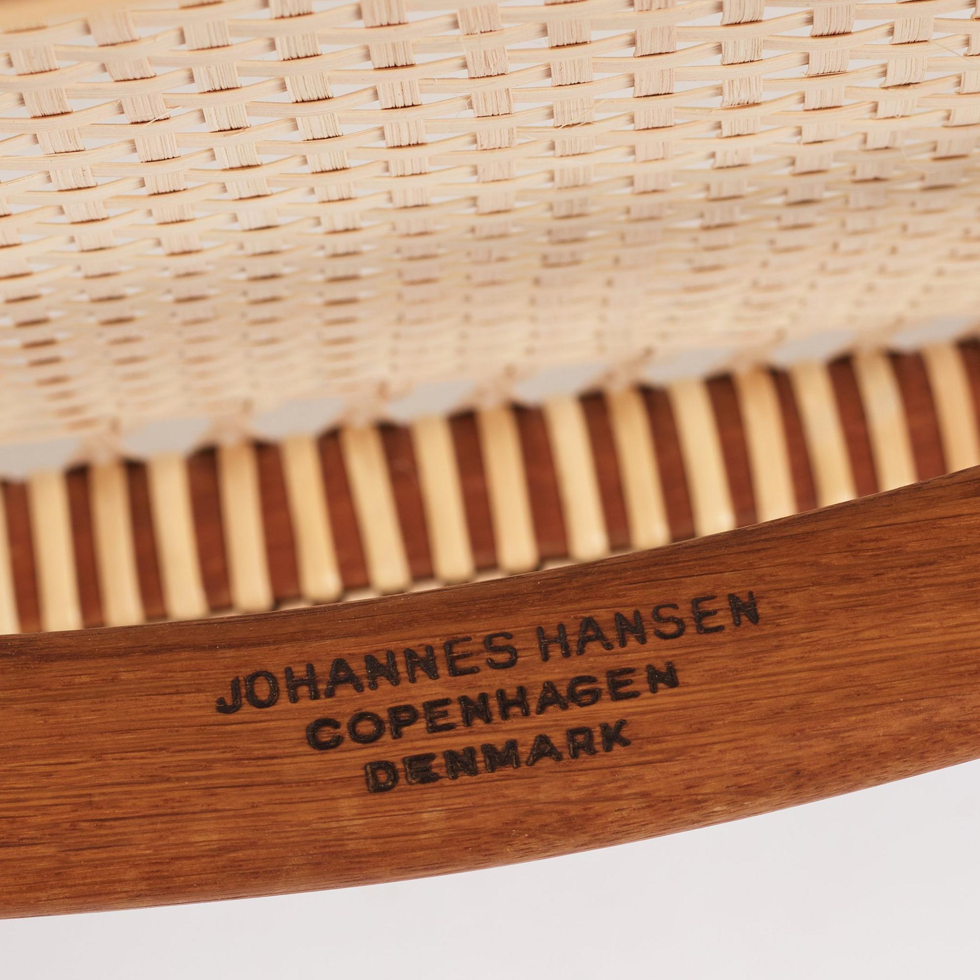 Hans J. Wegner, a pair of teak and rattan 'The Chair', JH-503, Johannes Hansen, Denmark 1950s.