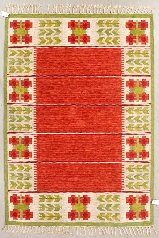 A signed Swedish flatweave by Berit Woelfer, 230 x 170.