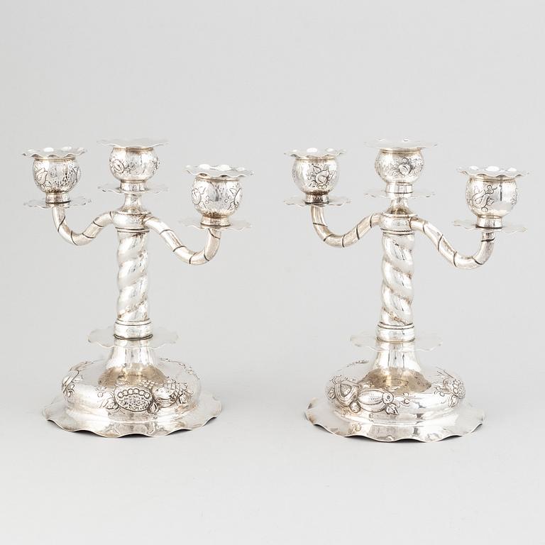 A pair of Swedish baroque-style silver candelabra, mark of CG Hallberg, Stockholm 1926.